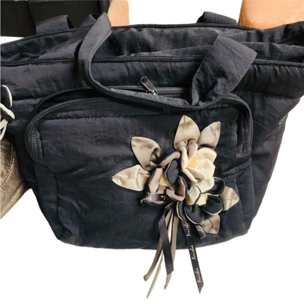 Arisha black super cute microfiber like fabric bag w/ attached flower detail